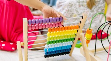 Photo by Yan Krukau: https://www.pexels.com/photo/girl-holding-multi-colored-wooden-abacus-8613095/