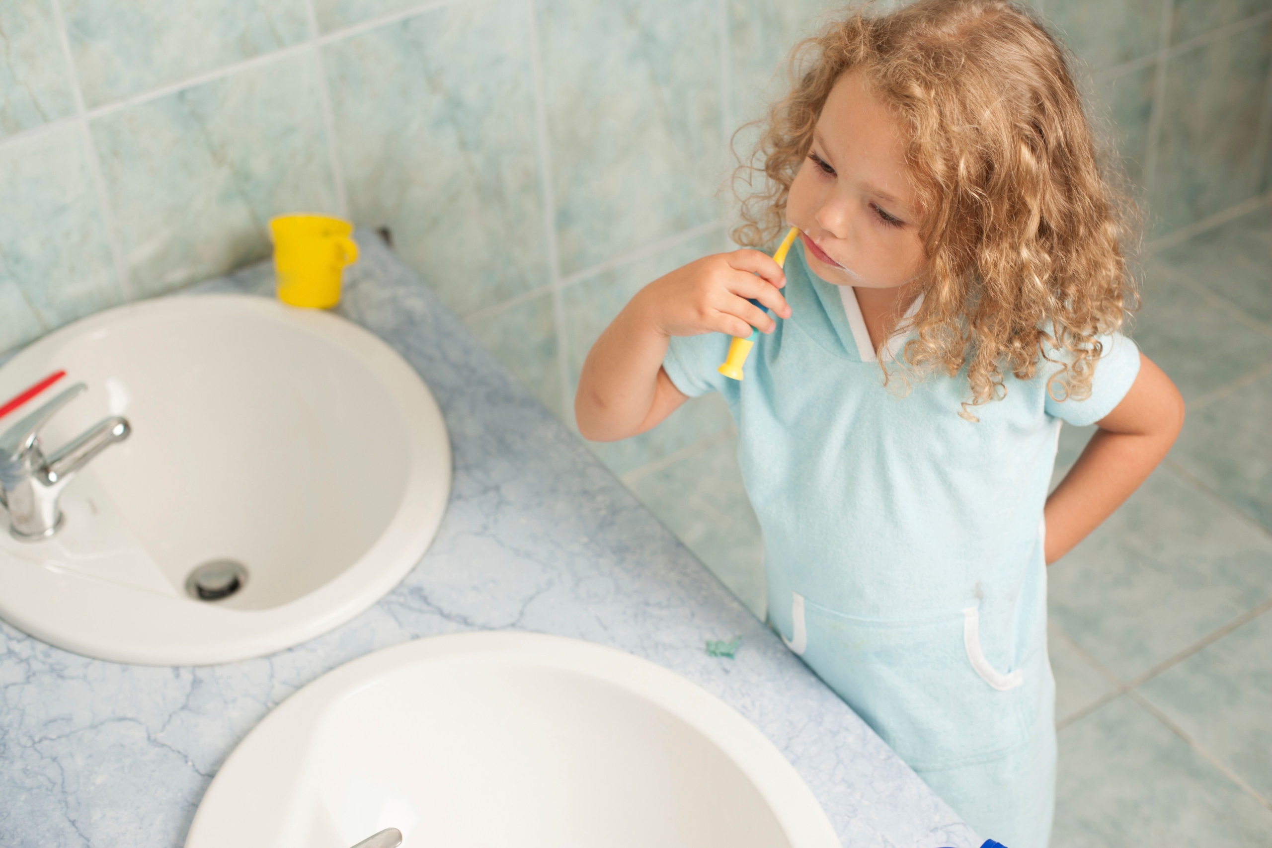https://www.pexels.com/photo/little-girl-brushing-her-teeth-12645015/